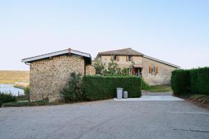 a house with a driveway in front of a building at Le Côte-Rôtie in Vérin +9 photos