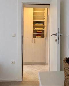 a room with a door open to a closet at Sun House in Kumbor