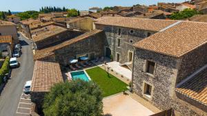 an aerial view of a building with a yard at Domaine Croix-Maro in Caux