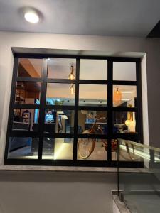 a room with a window with a bike in it at Vasilia Cove Boutique Hotel in Nicosia