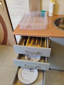 a kitchen with a sink and a counter with drawers at Willa Aronia in Szczawnica +35 photos
