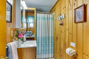 a bathroom with a sink and a shower at Sunset Views & Deck: Lake Champlain Cottage! in Swanton +19 photos