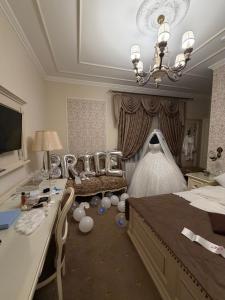 a bedroom with a bed and a large mirror at Boutique Tosca Regal in Bacău
