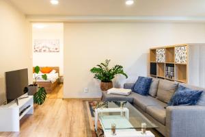 a living room with a couch and a table at Nature Apartment Karlovy Vary Kolová in Karlovy Vary