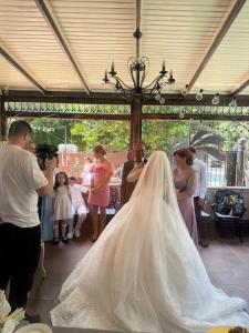 a bride and groom getting ready for their wedding ceremony at Boutique Tosca Regal in Bacău