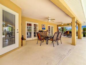 a dining room with a table and chairs at 3BR Home Trailside Pool & Jacuzzi, Minutes from Inverness, Ocala & Crystal River in Inverness