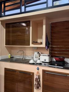 a kitchen with a sink and a counter top at CS phangan Villa in Ko Phangan