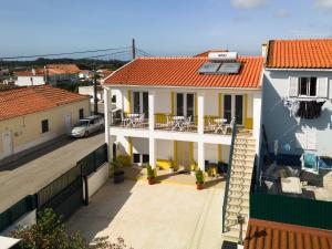 a view of a house with a balcony at Pátio Mariano in Serra de El-Rei