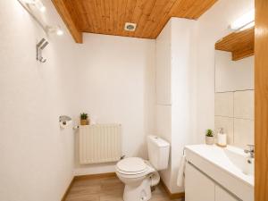 a bathroom with a toilet and a sink at Le Condrieu in Vérin +7 photos