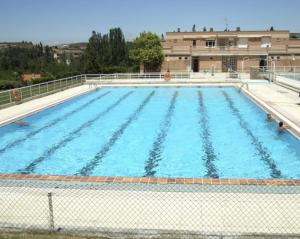 a large swimming pool with blue water at Selbaondoa, Casa con Patio en el Prepirineo Navarro in Lumbier