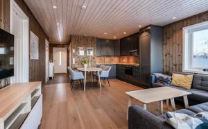 a living room with a couch and a table at Bualie leilighet in Gol +16 photos