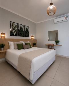 a bedroom with a large bed in a room at Vila Francesa Hotel in Penedo +38 photos