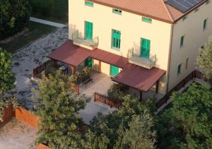 an overhead view of a house with two balconies at Podere Cafasso Country House in Paestum