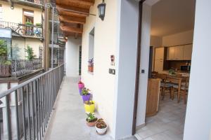 a balcony with potted plants on the side of a building at Da ME in Aosta