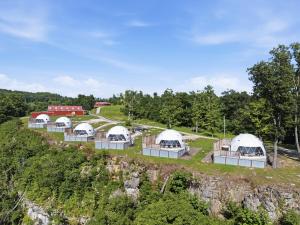 an aerial view of a group of domes on a hill at "Cloud Chaser" - The Overlook LUX Dome - RRG in Stanton