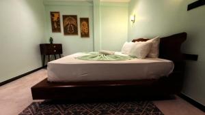 a bedroom with a large bed in a room at Abbi Holiday - Jaffna Hotel in Jaffna