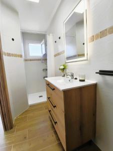 a bathroom with a sink and a mirror at Alojamientos El Pardal in Molinicos +9 photos