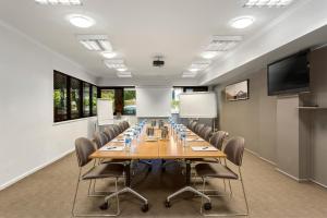 a conference room with a long table and chairs at Quest Mont Albert in Box Hill