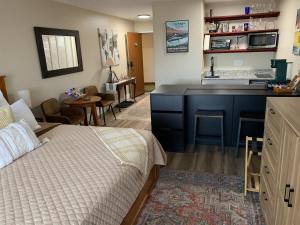 a bedroom with a bed and a kitchen with a sink at little mountain haven in Mount Torry Furnace