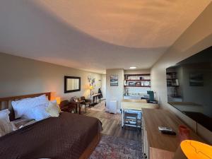 a bedroom with a bed and a living room at little mountain haven in Mount Torry Furnace
