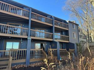 an apartment building with balconies on the side of it at little mountain haven in Mount Torry Furnace