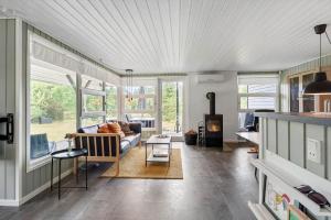a living room with a couch and a fireplace at LF16127-Logstor-Amandasvej-27 in Trend