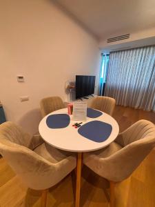 a meeting room with a table and chairs at VOGH Olimp Premium Sea View Escape in Olimp