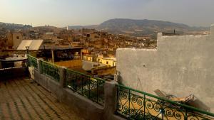 a view of a city from a balcony at Palais Doha & SPA in Fez