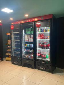 two refrigerators in a store with drinks in them at Blue Sunset Experince - Cabo Branco in João Pessoa