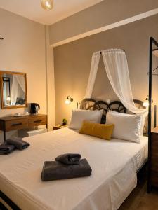 a bedroom with a large bed with two towels on it at Kokkala Guestrooms in Kokkala