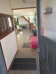 an open door to a room with a hallway at Alojamiento Adonai in Tolhuin +4 photos