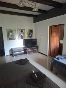 a living room with a bed and a couch at dom & weranda in Szczęsne