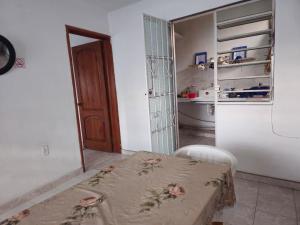 a kitchen with a table and a refrigerator at Casa el Monte in Valladolid