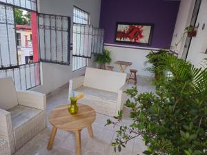 a living room with a couch and a table at Casa el Monte in Valladolid
