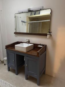 a bathroom vanity with a sink and a mirror at Ca Salentu in Galatone +12 photos