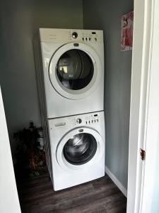 a washer and dryer in a corner of a room at The Private Perch in Nelson