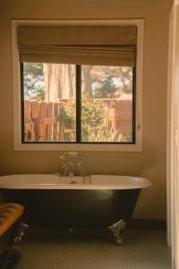 a bath tub in a room with a window at Oceanpoint Ranch in Cambria +33 photos