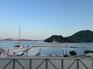 a dock with a boat in the water at Ventora Suites in Nydri