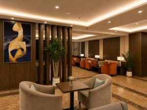 a hotel lobby with chairs and a table and a waiting room at فندق امان أبها - المحالة in Abha +61 photos