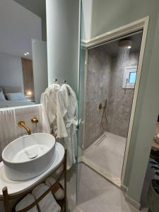a bathroom with a sink and a shower at Ventora Suites in Nydri +22 photos