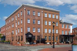 a large brick building with a street light in front of it at The William Fell Baltimore, Tapestry Collection by Hilton in Baltimore