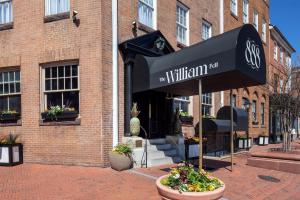 a building with a black awning in front of it at The William Fell Baltimore, Tapestry Collection by Hilton in Baltimore