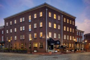 a large brick building on a city street at The William Fell Baltimore, Tapestry Collection by Hilton in Baltimore