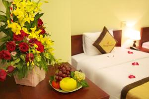 Rúm í herbergi á Danang Classic Hotel