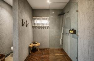 a bathroom with a shower and a table in it at Olivia Oceanfront Tulum in Tulum +15 photos