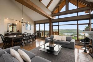a living room with a couch and a table at Tremblant Prestige - Altitude 170-9 in Mont-Tremblant