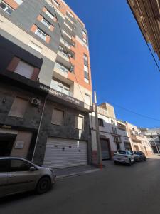 a car parked in front of a building at Résidence Luna in Oran