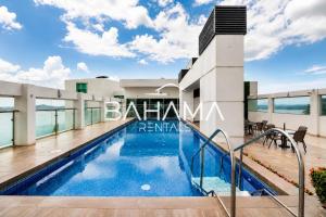 a villa with a swimming pool in a resort at THE VIEW AT RIVEFRONT by Bahama Rentals in Guayaquil