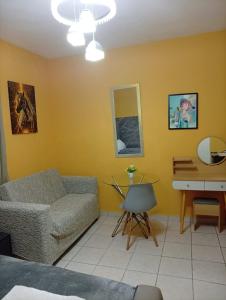 a living room with a couch and a table at Hotel Mango in Boca Chica