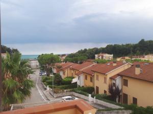 a view of a town with houses and a street at Casa Alice in Numana +5 photos